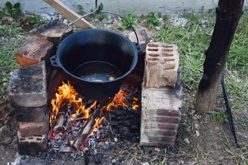 romanian cauldron (ceaun) with oil on the fire