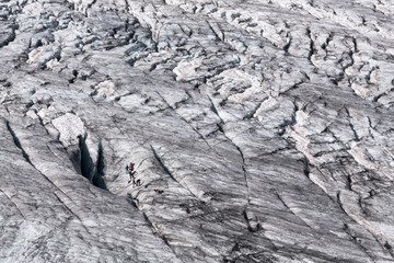Group of glacier climbers training in crevasse on Tour glacier