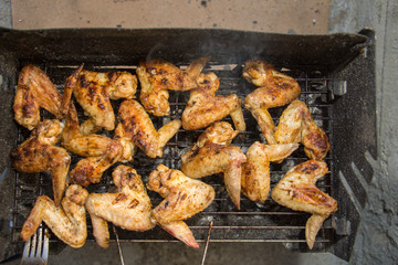 Chicken wings on barbecue grill 