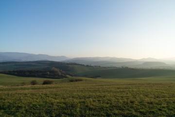 Naklejka premium Misty morning on meadow with trees and views. Slovakia
