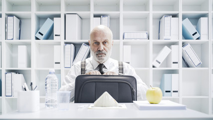 Business executive having a sad lonely meal