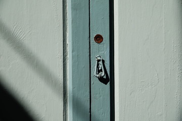 wooden door with lock and knocker