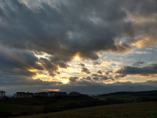 Naklejka na ściany i meble Sunset and sunrise with dramatic colorful clouds. Slovakia 