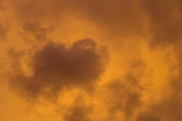 Dramatic clouds at colourful moody sunset