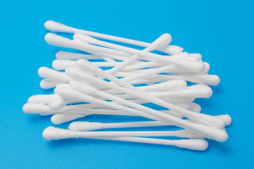 cotton buds isolated on blue background