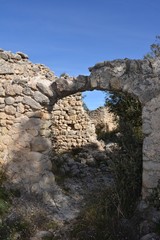 Ruined houses and crumbling walls in the abandoned Moorish village of L'Atzuvieta, Vall de Alcala, Marina Alta, Alicante Province, Valencia, Spain