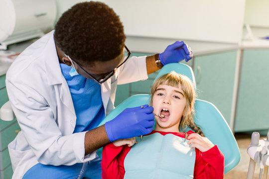 ooth treatment in a dental clinic. Children's dental medical department. Examination of the teeth in children.