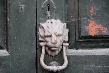 wooden door with lock and knocker