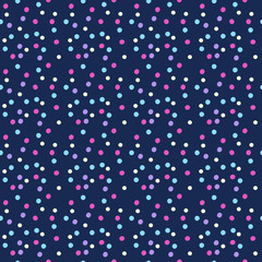 Round confetti of pink, blue, purple and yellow colours. Vector seamless pattern of colorful hand drawn dots on dark background.