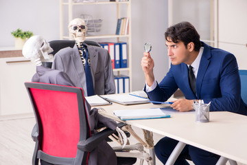 Fototapeta premium Funny business meeting with boss and skeletons