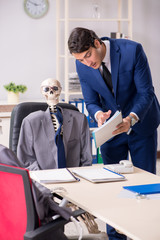 Funny business meeting with boss and skeletons