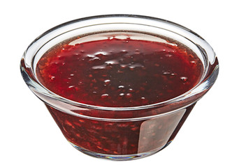 Bowl of raspberries jam isolated on white background. 
