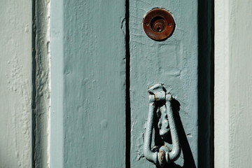 wooden door with lock and knocker