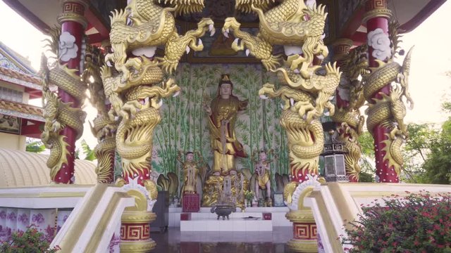 Statue of Goddess of mercy, Quan Yin or Guanyin with Shan cai and Long Nu Beside. 