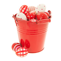 Red easter eggs in bucket