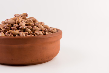 A plate of beans on white background