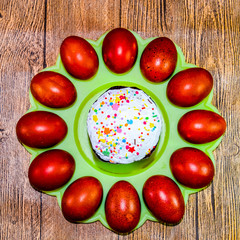 Easter cake and painted red Easter eggs. Food for the Easter tab