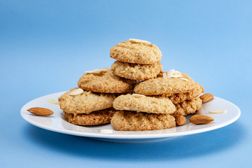 Gluten-Free Cookies almond with almond slice in white plate.