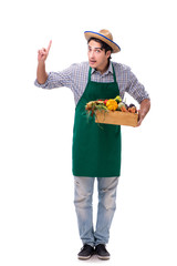 Young farmer with fresh produce isolated on white background