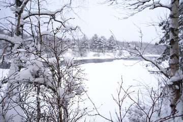 Fototapeta na wymiar Winter river covered in snow