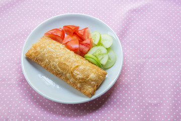 Corn pie with dish on table.