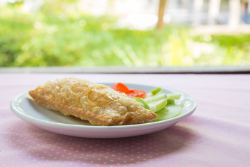Corn pie with dish on table.