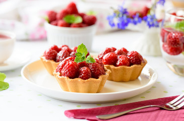 Homemade mini tarts with raspberries fruits