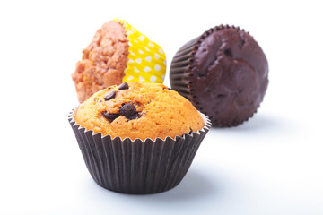 Assorted with Delicious homemade cupcakes with raisins and chocolate isolated on white background. Muffins. Top view.