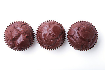 Assorted with Delicious homemade cupcakes with raisins and chocolate isolated on white background. Muffins. Top view. Copy space.