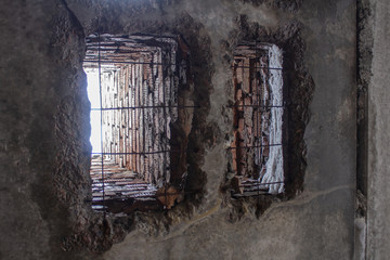 View of the brickwork through a hole in the concrete slab.