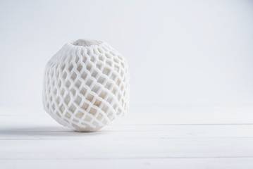 Tropical drinking coconut on white wood background.