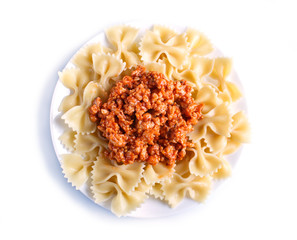 Farfalle bolognese pasta with minced meat isolated on white background.
