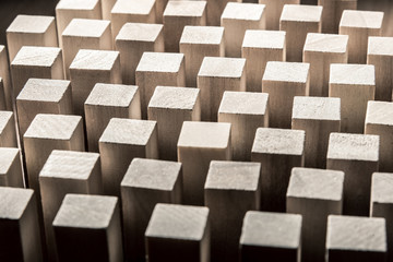 Risk and strategy in business, many identical wooden blocks