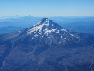 Fototapeta na wymiar Mount Hood, Oregon, photographed from the airplane window on a flight into Portland on a clear, cloudless autumn day.