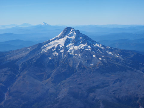 Mount Hood, Oregon, photographed from the airplane window on a flight into Portland on a clear, cloudless autumn day.