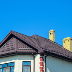 House with plastic windows and roof of corrugated sheet. Roofing