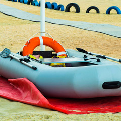 Inflatable Rescue Boat. Gray inflatable boat on the beach in the