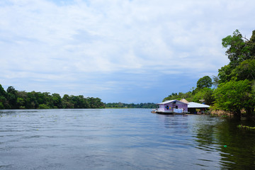 Naklejka premium Houses along Amazonas river. Brazilian panorama