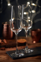 Shot of the champagne glass on a wooden table. bubbles.