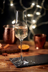 Shot of the champagne glass on a wooden table. bubbles.