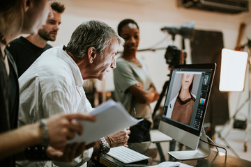 Team checking photos from a studio shoot