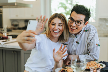 Couple taking a selfie during their dinner