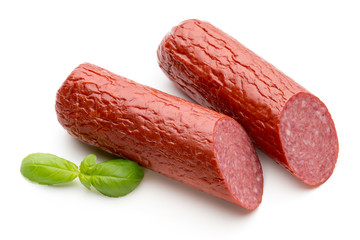 Salami smoked sausage, basil leaves on white background cutout.