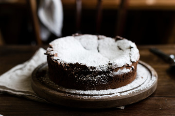 Chocolate fudge cake with icing sugar photography recipe idea