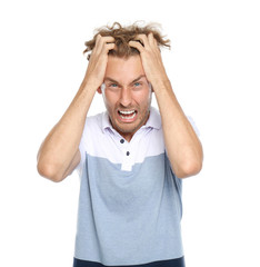 Young man in casual clothes posing on white background