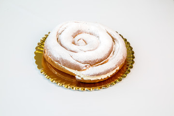 pastries in a gold tray on white background