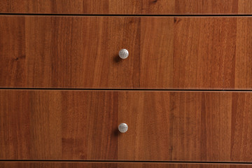 Wooden wardrobe drawers as background, closeup view