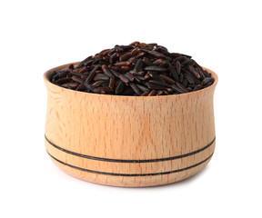Bowl with uncooked black rice on white background