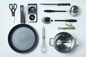 Flat lay composition with clean cookware on light background