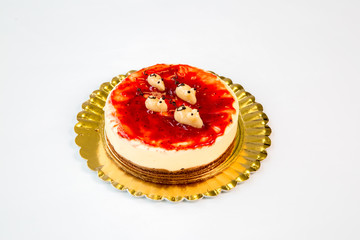 cheesecake on a gold tray on white background
